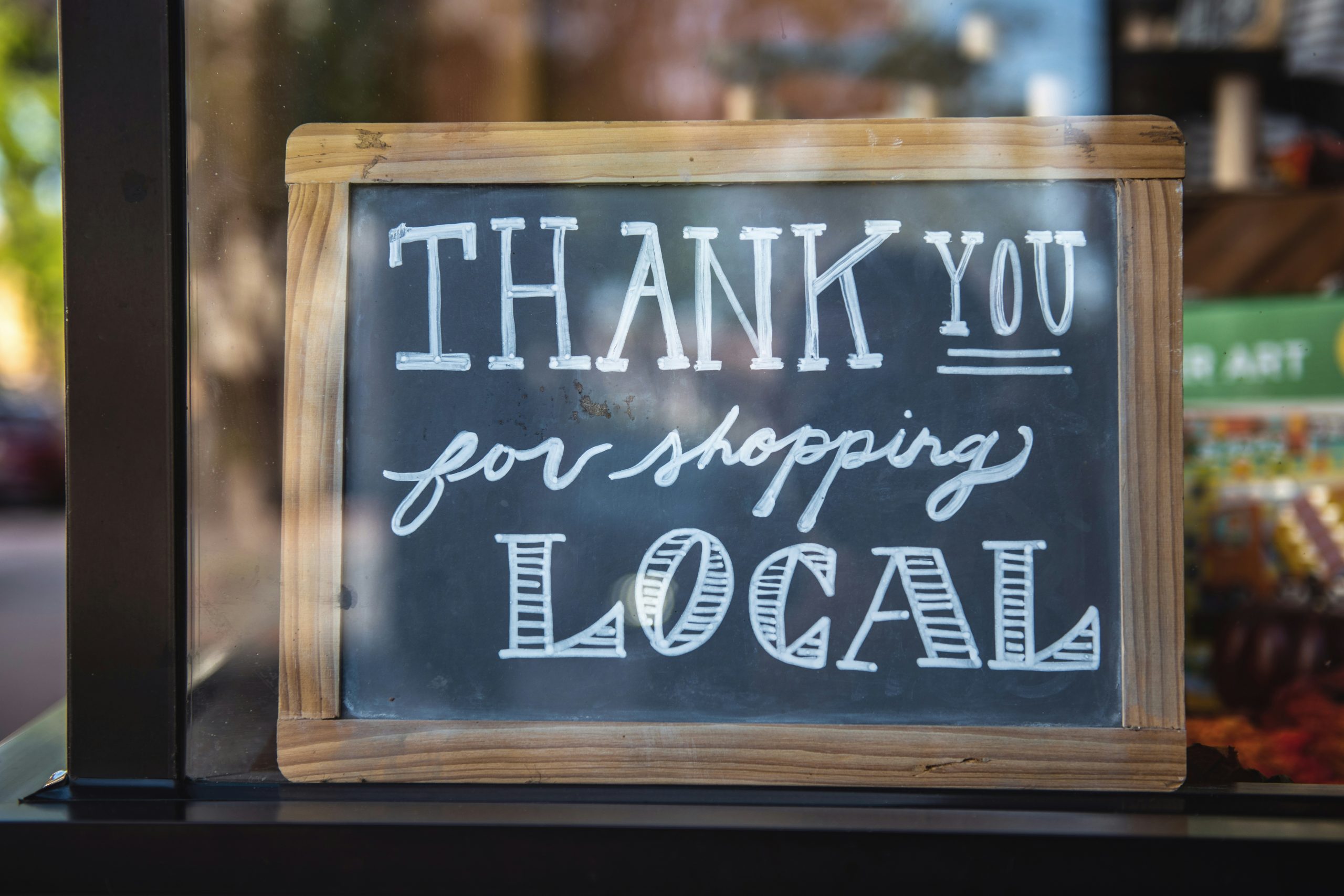 Local business sign thanking its customers.